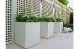 Squares powder coated in RAL 9010 (Pure White). The design incorporates small plinths to create a 'shadow gap'.