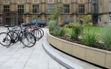 Steel planter clad with natural stone