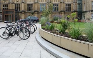 Steel planter clad with natural stone