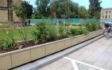 Steel planter clad with natural stone