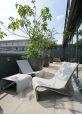Sponeck chair and table with Boulevard planters