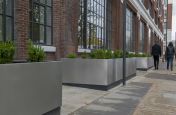 Custom sized, mixed stainless steel planters for Grade 2 listed offices