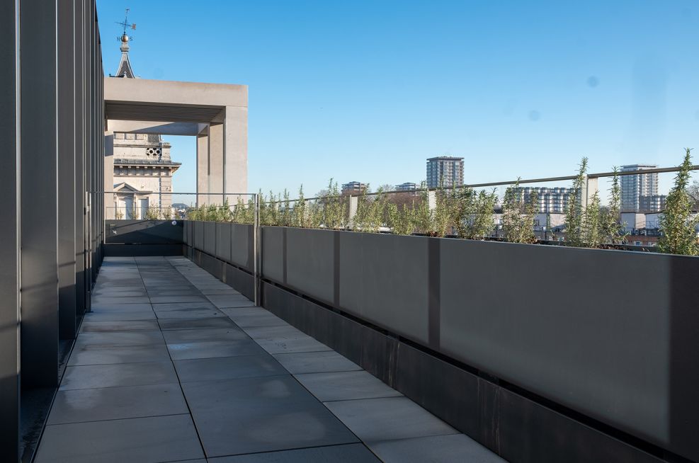 Terrace perimeter planters with metal balustrade