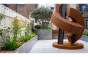 Perimeter planters around steel sculpture