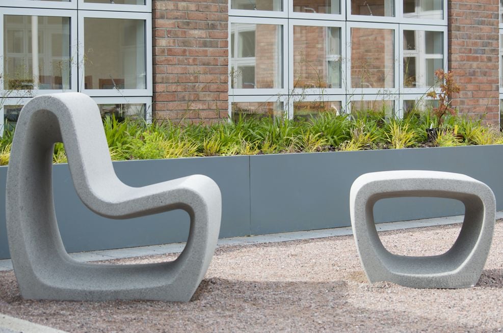 Outside courtyard with garden furniture and blue grey planter