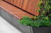 Hardwood bench seating stainless steel planter