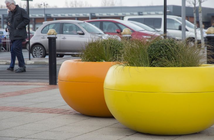 Brightly coloured composite planters 