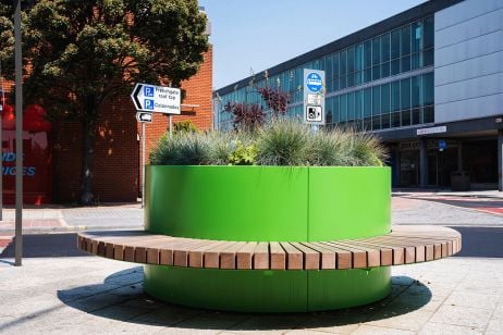 Bold coloured street planter with seating