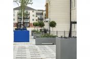 Steel planters for communal podium decks