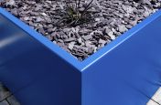 Coloured metal plant containers