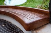 Hardwood slatted curved bench