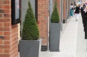 IOTA Tall Taper Granite planters at Gloucester Quays Designer Outlet Shopping Mall.