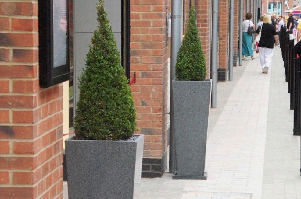 IOTA Tall Taper Granite planters at Gloucester Quays Designer Outlet Shopping Mall.
