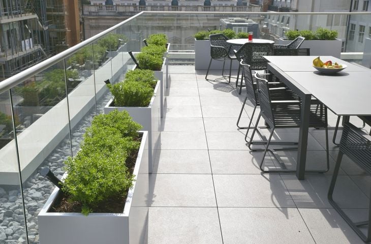 Individual steel trough planters add some green to a London terrace 