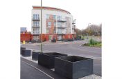 IOTA Granite Planters Installed On The Pavement