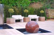 Central Water Feature And Coloured Granite Planters