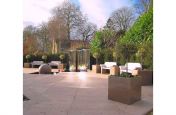 Hard Landscaping With Granite Planters Around The Perimeter