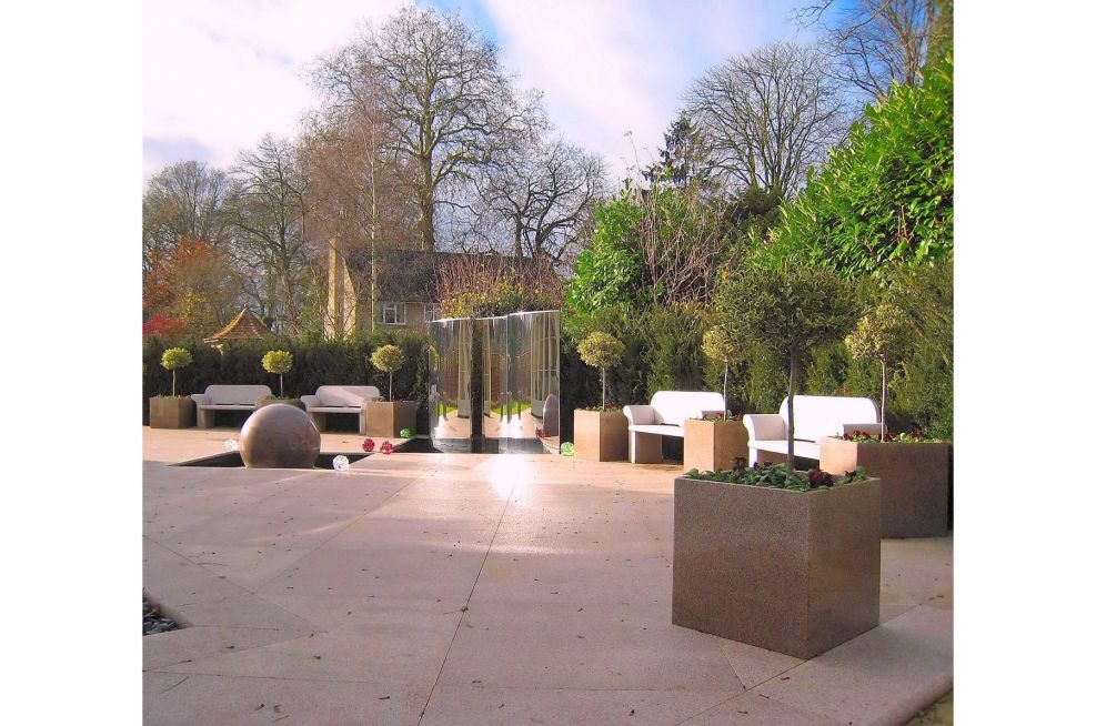 Hard Landscaping With Granite Planters Around The Perimeter