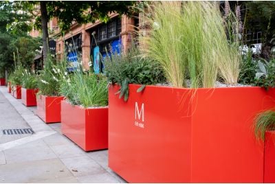 coral red street planters in Mayfair