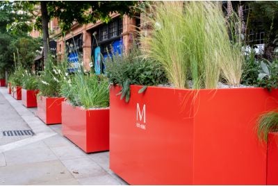 coral red street planters in Mayfair