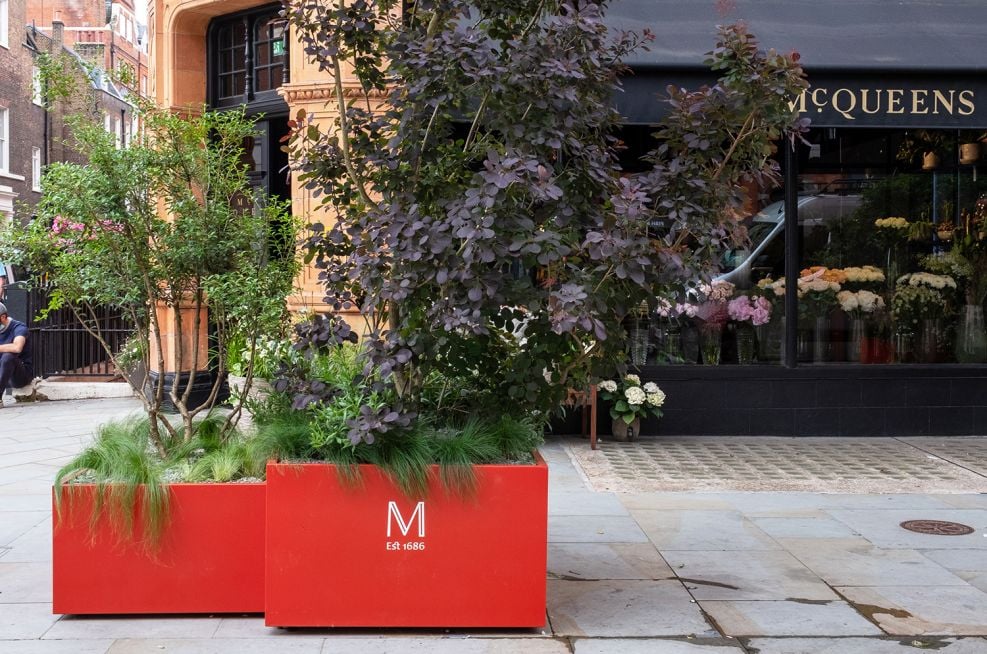 Large street planters with branding