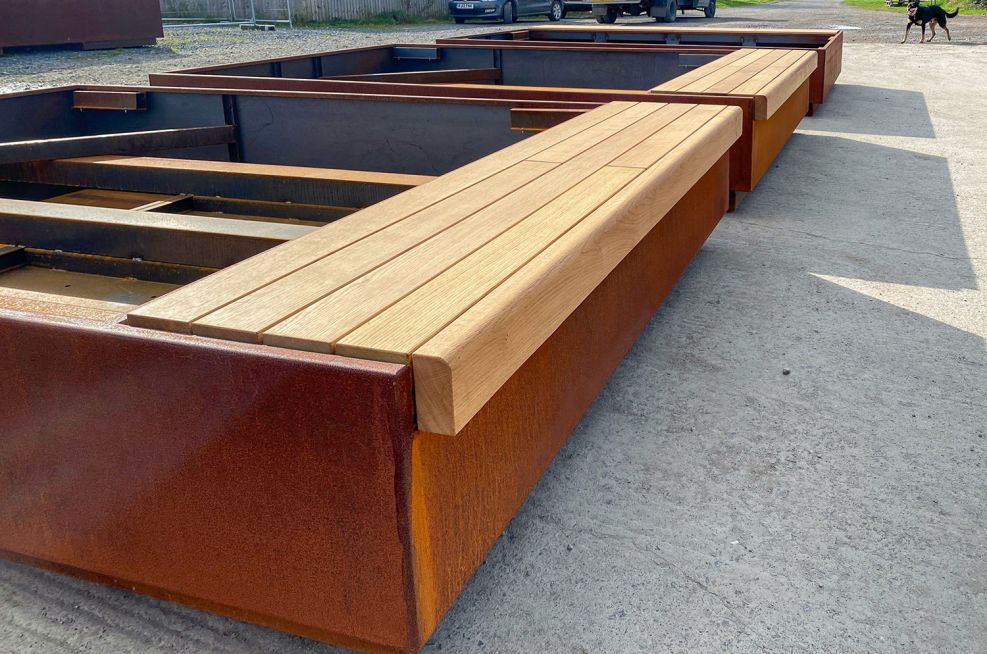 Timber bench for metal landscaping planters