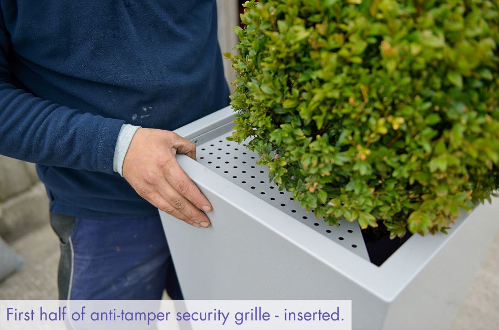 Planter security grille installation