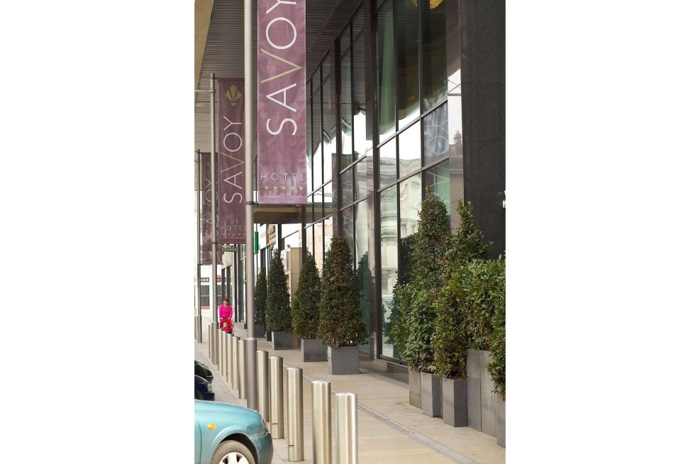 Planters Lining The Pavement Outside The Savoy