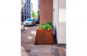 Corten steel planter with variable height rim