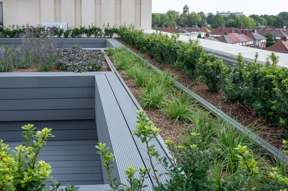 Rooftop planters with composite wood cladding