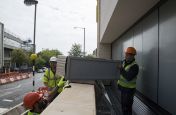 Bespoke Steel Planters With A RAL 9006 Coating Lifted Into Place