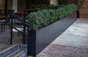 Slim boundary planters for seating