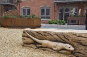 Large Corten Steel Planter And Wooden Carving